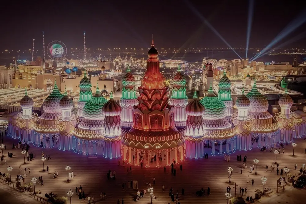 The pavilions of Global Village lit at night