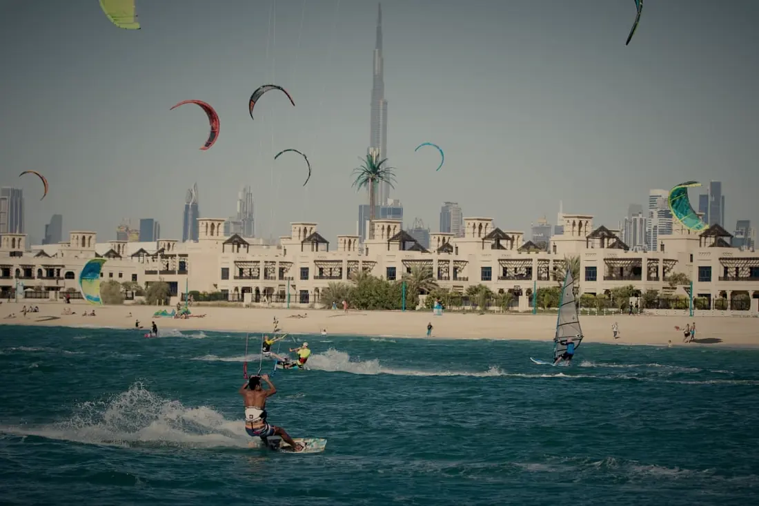 Kitesurfers off Kite Beach in Jumeirah, with the Burj Khalifa on the horizon