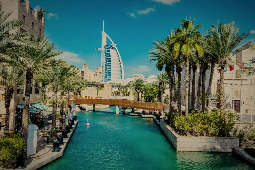 The waterways of Madinat Jumeirah, with the Burj Al Arab beyond the palms