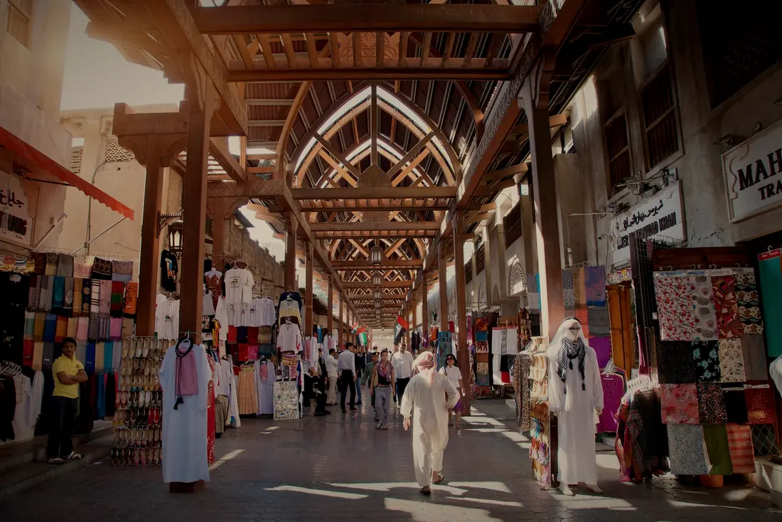 The covered Old Souk in Bur Dubai, with fabric shops under wooden arches
