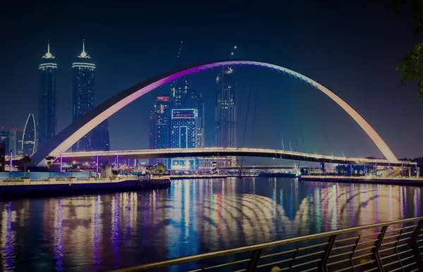 The Tolerance Bridge over the Dubai Water Canal, lit at night